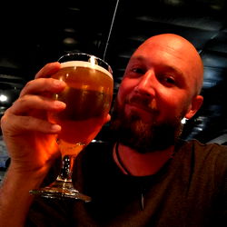 Casually celebrating with a beer