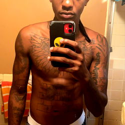 Huncho in a Bathroom Mirror