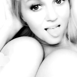 Model with Playful Pose and Striped Swimsuit