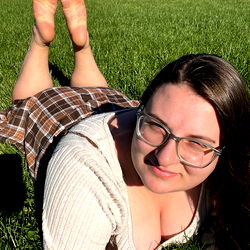 Casual, Smiling Young Woman in Grass