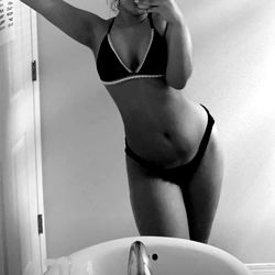 Model in a Bathroom Mirror