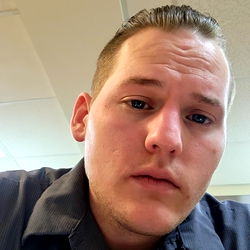 Solemn Man in Office Setting