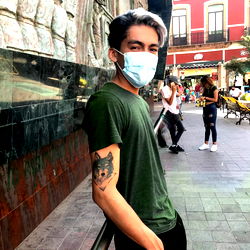 Stylish Andro Poses Against a City Backdrop