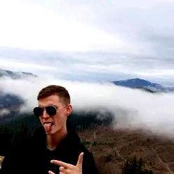 Romanian Man in Outdoors, Fingers in Mouth