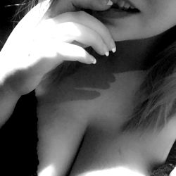 Ashli Lynne in a lingerie pose with finger to mouth