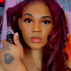 Kenoh2o - Mississippi-based OnlyFans model with long hair, wearing a red and white outfit