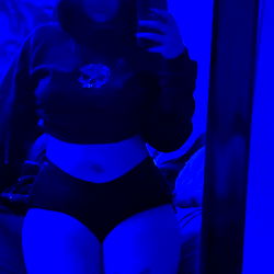 Abb, the OnlyFans Model Posing in Blue Light