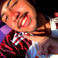 Smiling Young Man in Sunglasses and Cap, Holding Baseball Glove