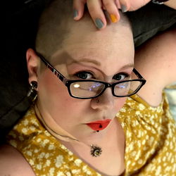 A Woman with Short Hair and Glasses