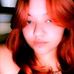 Red-haired model in a black shirt