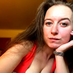 Schuyler Thrace, a seductive OnlyFans model posing in a red bikini