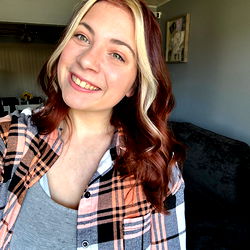 Beautiful young woman with red hair and a smile