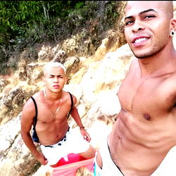 Two men posing on rocky terrain