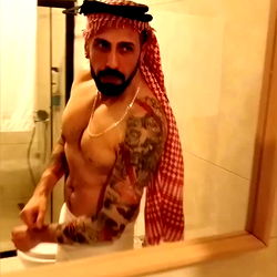 Model in bathroom mirror