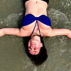 Rachel, the beautiful beach model in a blue bikini