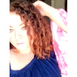 Saucy Jocy posing confidently in a cozy living room