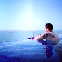 Andres Benavides, Relaxing at an Infinity Pool