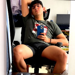 Andre from Bogotá, Relaxing with a Blue Cell Phone