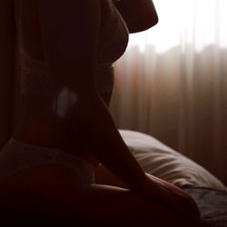 OnlyFans Model Astrid Wilde Sitting in Bedroom, 150 Characters