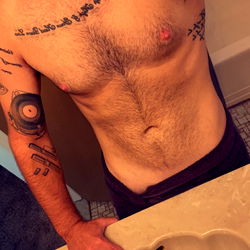 Model Showcasing Abs in Bathroom