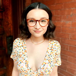 Stylish Woman with Brown Hair and Glasses