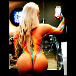 OnlyFans Model Suzy Q. in Seductive Pose with Tattoos and Piercings