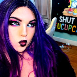 OnlyFans Model with Gender-Specific Eye Makeup and Purple Hair