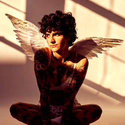 Vintage Model Posing with Angel Wings