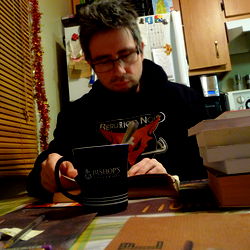 A person working at a desk with books