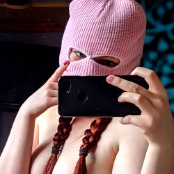 OnlyFans Model Ruby 🌹 Taking a Selfie with Pink Mask and Bun Hair
