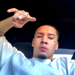 Alex, a rapper with a playful demeanor