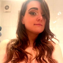 Liverpool-based model 69sexyfairy strikes a pose in the bathroom mirror