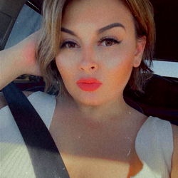 Ara, the Texas-Based OnlyFans Model, Poses in a White Tank Top