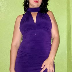 Alexa 34, a striking red dress and confident pose