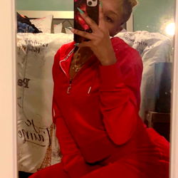 Ajahney's playful pose in red pajamas