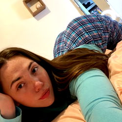 Amy De Anda in a cozy pose on her bed