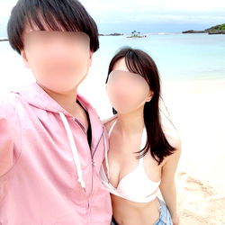 Two People Posing at a Beach