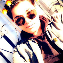 Al, A Model, Poses for a Selfie with Smoke Flair Effects