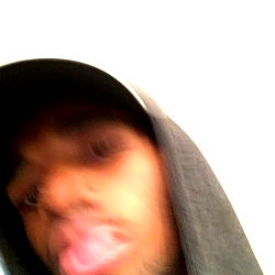 Person in hoodie wearing baseball cap