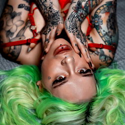 Stylized OnlyFans Model in Red Lingerie and Blue Hair