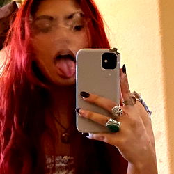 Grace, a Model Taking a Selfie with Her Phone