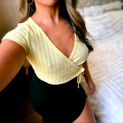 Model AznVxn in a Yellow Top and Shorts