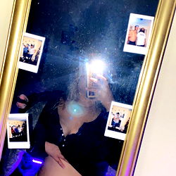 Slimthick in a Bathroom Mirror