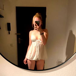 Onlyfans model Alice Hilton in a white lingerie photoshoot