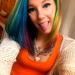Stylish OnlyFans Model with Vivid Hair and Colorful Makeup