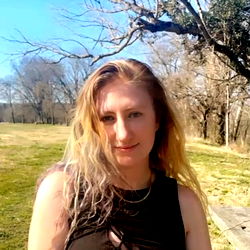 Kelly in OnlyFans Outfit, Smiling for the Camera