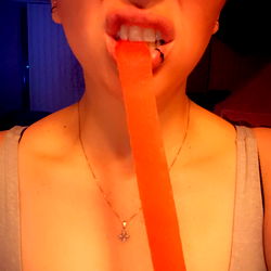 Funny OnlyFans Moment: AlexaEve Playfully Holding Red Gummy Brush
