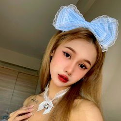 Model with Blue Bow and Heart Necklace