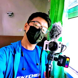 Influencer with Camera Gear on a Train