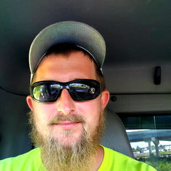 Bearded Man with Hat, Sunglasses and Cap in Van